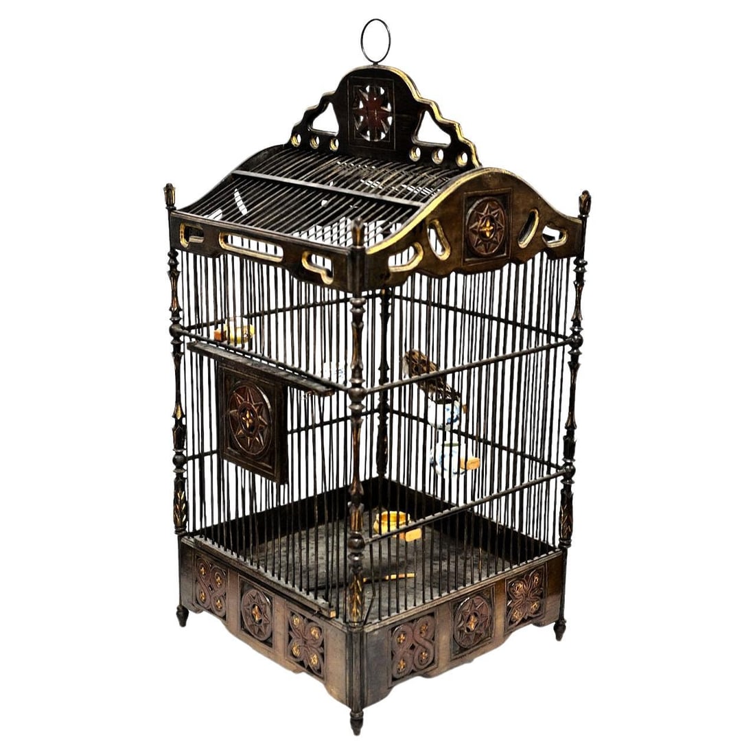 Early 20th Century Chinese Wood Bird Cage with Porcelain Bowls and Taxidermy Songbird: Early 20th Century Chinese Wood Bird Cage with Porcelain Bowls and Taxidermy Songbird This vintage Chinese bird cage from the early 20th century features a large carved wooden structure with partial g