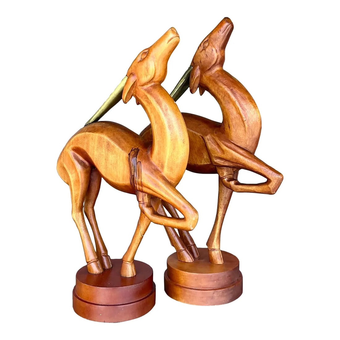 Vintage Boho Hand-Carved Wooden Gazelle Sculpture Pair with Brass Horn: Vintage Boho Hand-Carved Wooden Gazelle Sculpture Pair with Brass Horn Elevate your home decor with this stunning pair of Vintage Boho Carved Wooden Gazelles. These captivating hand-carved sculptures 