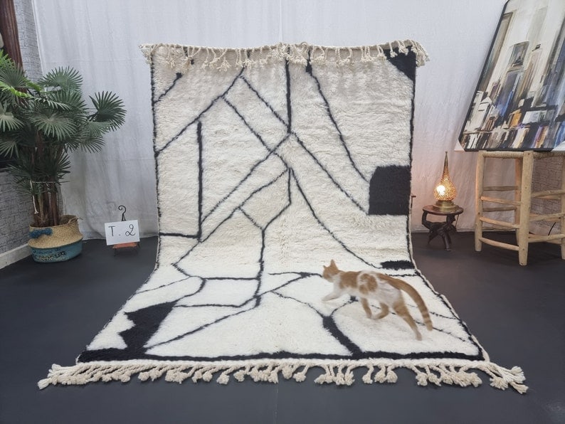 Elegant Handmade Moroccan Berber Wool Rug 8 x 5 Feet: Elegant Handmade Moroccan Berber Wool Rug 8 x 5 Feet Transform your space with this elegant and authentic handmade Moroccan Berber wool rug. Crafted by skilled local Berber women weavers in the Atlas 