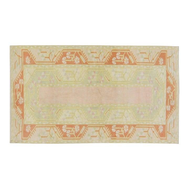 Hand-Knotted Wool Anatolian Rug in Tan 3'9" x 6'6": Hand-Knotted Wool Anatolian Rug in Tan 3'9" x 6'6" This vintage Turkish Anatolian rug is hand-knotted from wool, showcasing traditional craftsmanship combined with a modern design sensibility. Its sof