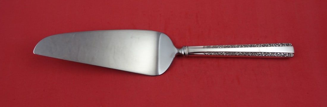 International Sterling Silver Romance Pie Server 10 3/4": International Sterling Silver Romance Pie Server 10 3/4" Introducing the Romance Pie Server by International, a stunning addition to your tableware collection. Crafted from high-quality sterling silve