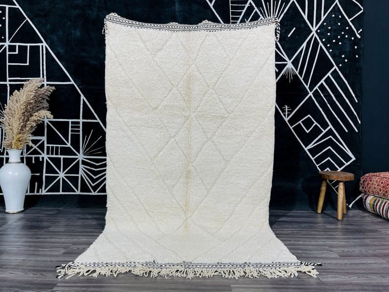 Authentic 8 x 5 Feet Moroccan Berber Rug Geometric Pattern: Authentic 8 x 5 Feet Moroccan Berber Rug Geometric Pattern Discover the elegance of this Authentic Soft White Moroccan Berber Rug, showcasing a beautifully engraved geometric pattern. Handwoven by ski