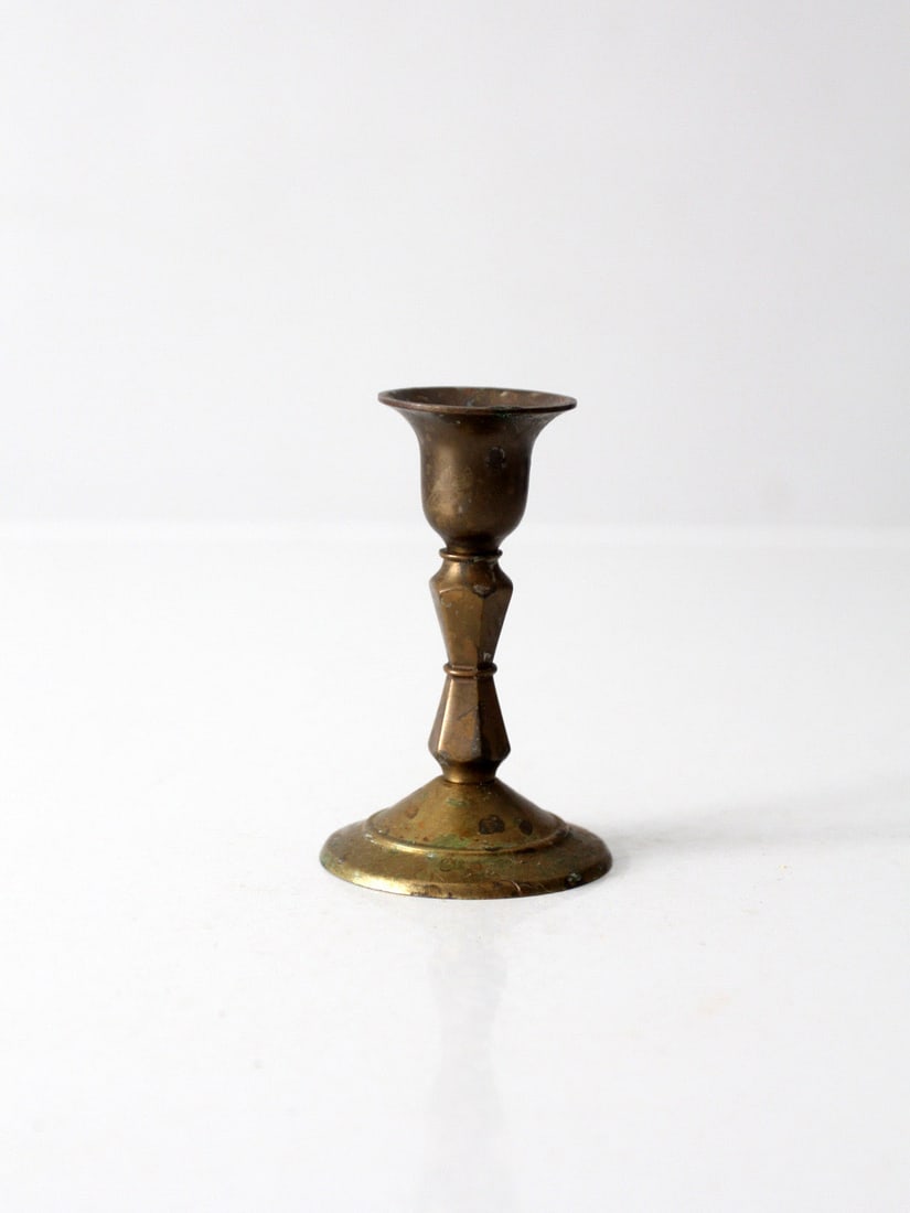 Turned Brass Taper Candle Holder Vintage Pedestal Form: Turned Brass Taper Candle Holder Vintage Pedestal Form Vintage brass candlestick holder with a turned pedestal shape, flared rim, and traditional silhouette. It is designed to fit a standard taper can