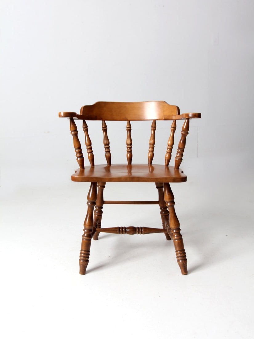 Mid Century Pub Style Captains Chair with Spindle Back: Mid Century Pub Style Captains Chair with Spindle Back Introducing a classic Mid Century Captains Chair, a perfect blend of style and comfort for your dining space. This vintage pub-style dining chair