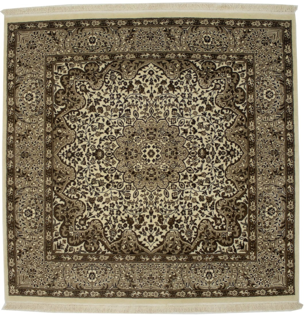 Square 5x5 Wool Floral Kirman Hand-Knotted Area Rug from India: Square 5x5 Wool Floral Kirman Hand-Knotted Area Rug from India This hand-knotted Kirman area rug features a fine floral pattern in cream, brown, and khaki tones. Crafted from wool, it has a square sha