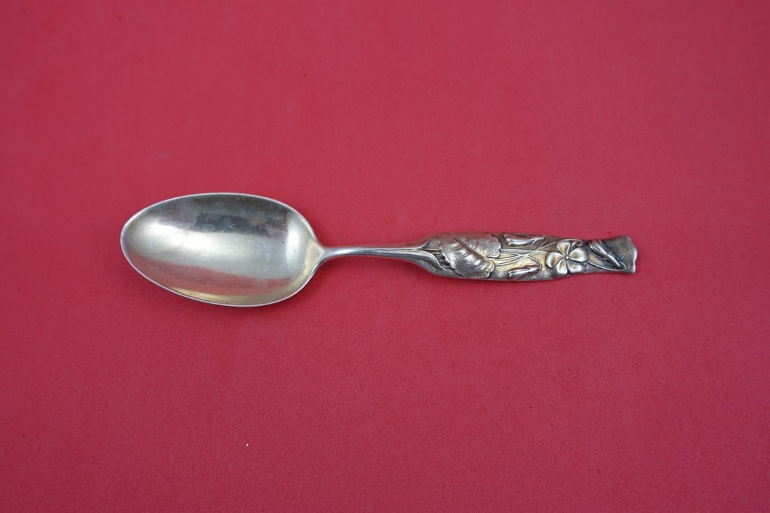 Sterling Silver Flora Pattern Teaspoon with Violet Motif by Shiebler 5.75 Inch: Sterling Silver Flora Pattern Teaspoon with Violet Motif by Shiebler 5.75 Inch This antique teaspoon is crafted in sterling silver by Shiebler in the Flora pattern, featuring a violet motif. The spoon