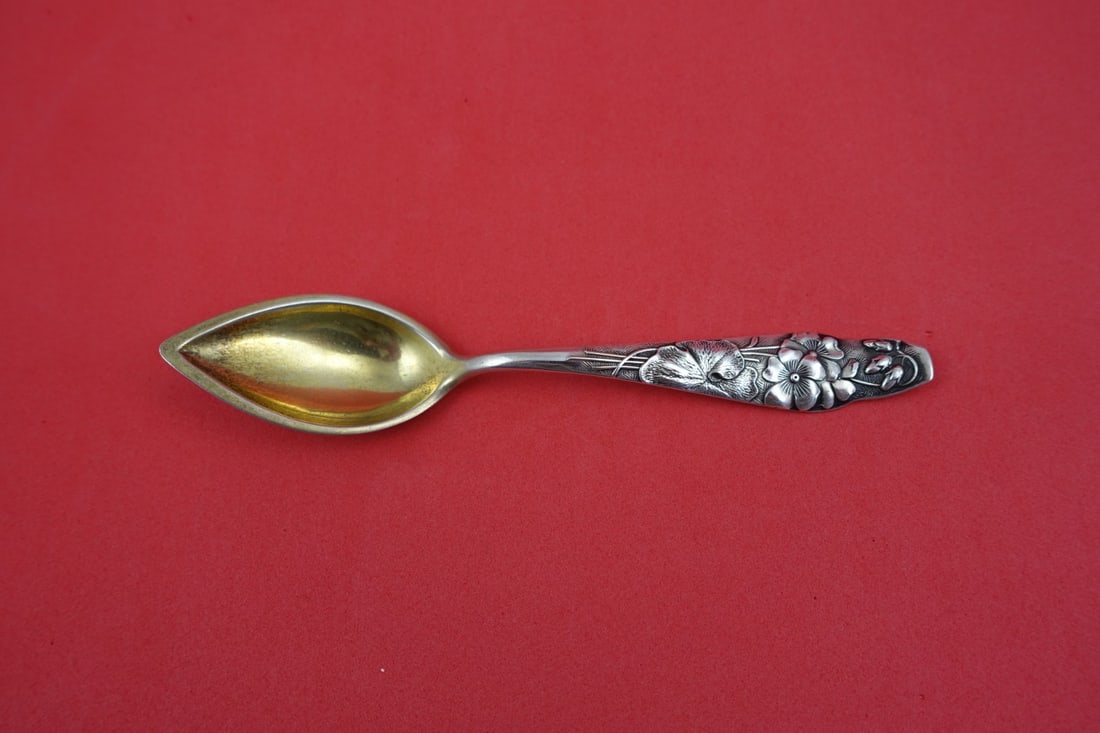 Gold Washed Sterling Grapefruit Spoon Flora Pattern by Shiebler 5 3/4 Inch: Gold Washed Sterling Grapefruit Spoon Flora Pattern by Shiebler 5 3/4 Inch This is a Shiebler Flora pattern sterling silver grapefruit spoon featuring a gold washed finish and a geranium motif. The sp