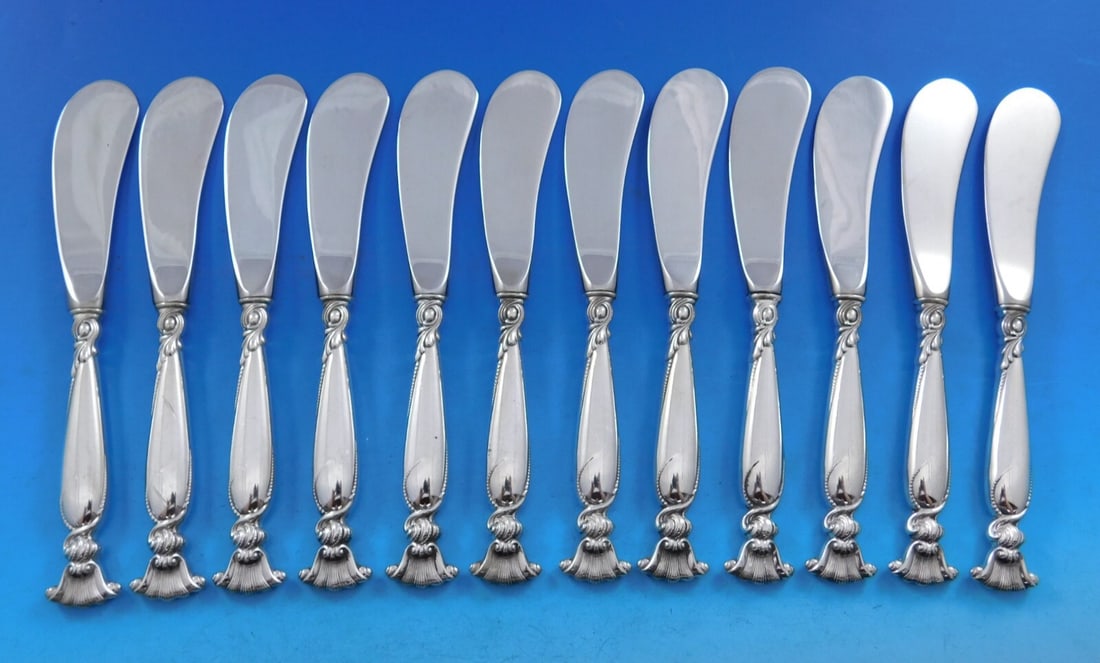 Wallace Romance of the Sea Sterling Silver Butter Spreader Set 12 pcs 6 1/4 inches: Wallace Romance of the Sea Sterling Silver Butter Spreader Set 12 pcs 6 1/4 inches This elegant set of 12 butter spreaders features the exquisite "Romance of the Sea" pattern by Wallace. Each spreader