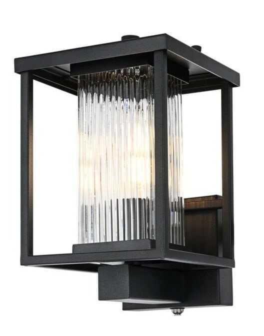 Dover Outdoor Wall Sconce Black Reeded Glass 11.5 in: Dover Outdoor Wall Sconce Black Reeded Glass 11.5 in Outdoor wall sconce light fixture with a black finish, reeded glass, and iron and glass construction. It is hardwired electric, wet rated, waterpro