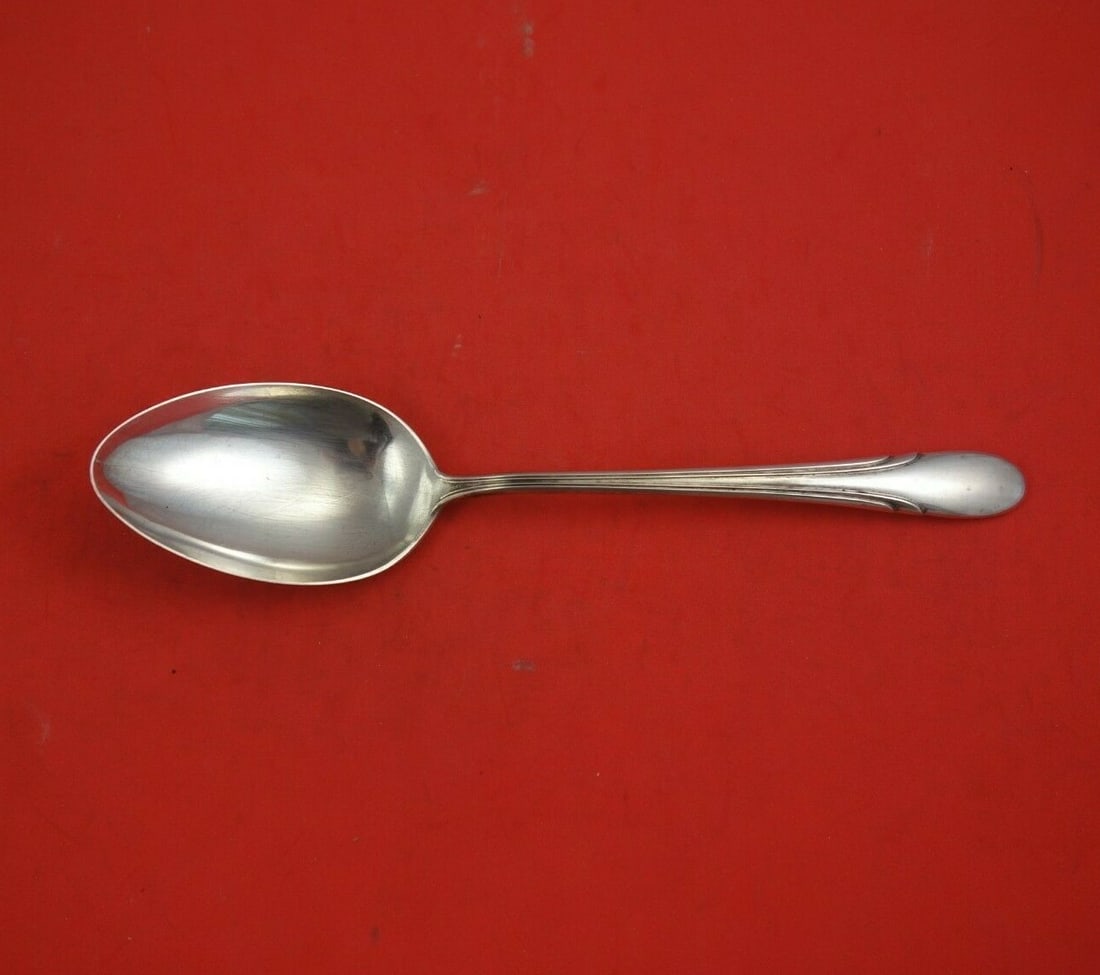 Towle Symphony Vintage Sterling Silver Serving Spoon 8 5/8": Towle Symphony Vintage Sterling Silver Serving Spoon 8 5/8" This exquisite serving spoon is part of the Symphony pattern by Towle, crafted from high-quality sterling silver. Measuring 8 5/8 inches, it