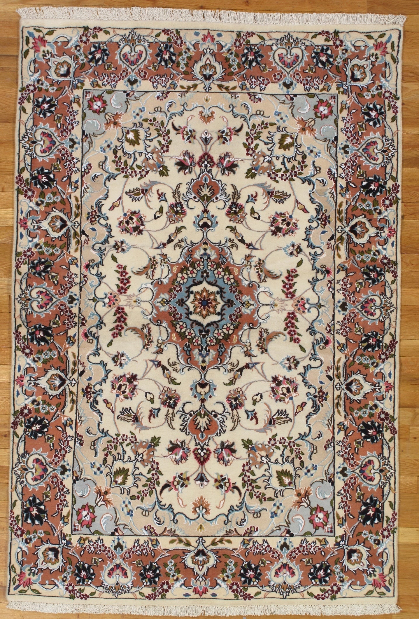 4.3 x 6.5 Persian Tabriz Hand-Knotted Wool Silk Rug from Iran: 4.3 x 6.5 Persian Tabriz Hand-Knotted Wool Silk Rug from Iran Free continental US Shipping This authentic Persian Tabriz rug is meticulously hand-knotted by skilled artisans in Iran, using a blend of 