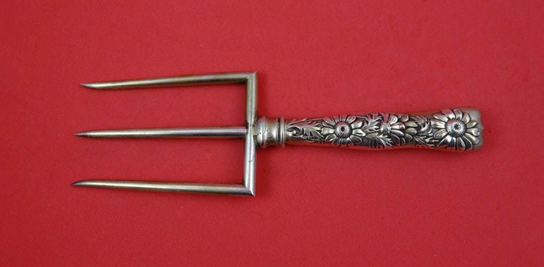 Sterling Silver Toast Fork Flora Pattern by Shiebler with Daisy Motif 7.25 Inch: Sterling Silver Toast Fork Flora Pattern by Shiebler with Daisy Motif 7.25 Inch This is a sterling silver hollow handle toast fork featuring a daisy motif in the Flora pattern by Shiebler. The piece i