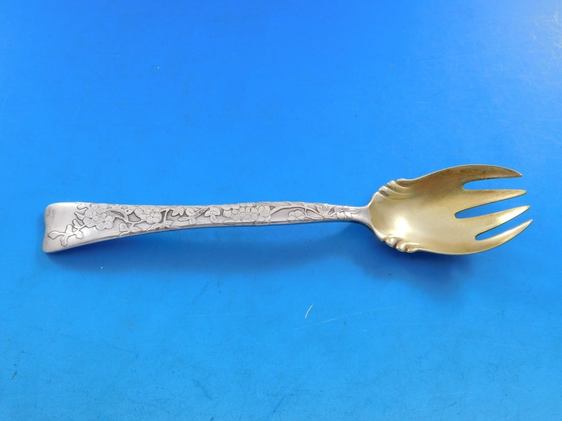 Tiffany Sterling Silver Ice Cream Fork Lap Over Edge 5 3/4" Gold-Washed Forget Me Not: Tiffany Sterling Silver Ice Cream Fork Lap Over Edge 5 3/4" Gold-Washed Forget Me Not This exquisite ice cream fork from Tiffany & Co. features the elegant Lap Over Edge pattern. Crafted from high-qua