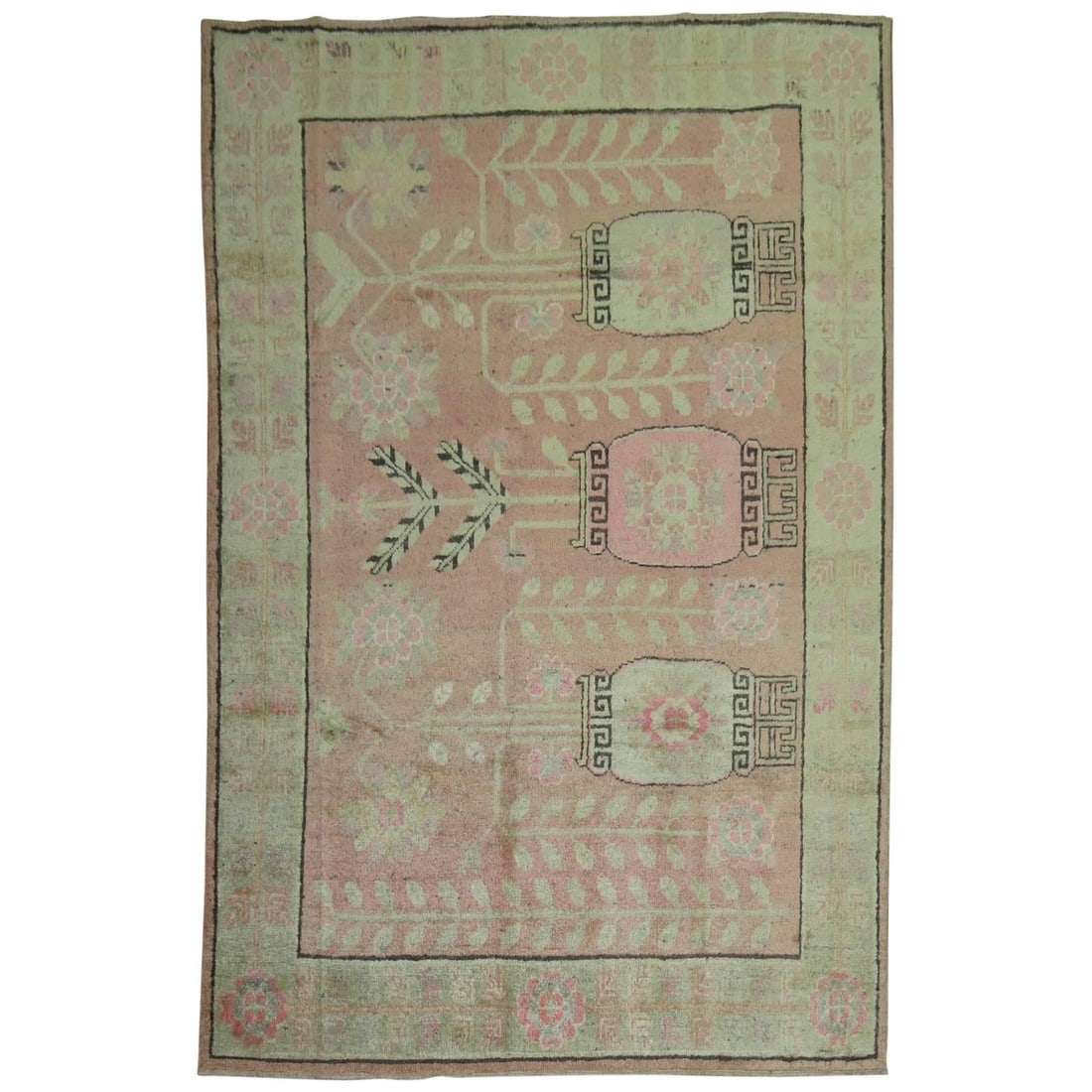 1930s Wool Khotan Rug in Pink and Green 66 x 91 in: 1930s Wool Khotan Rug in Pink and Green 66 x 91 in This one-of-a-kind Khotan rug from East Turkestan dates to circa 1930 and features a soft pink field adorned with a flower vase motif, complemented b