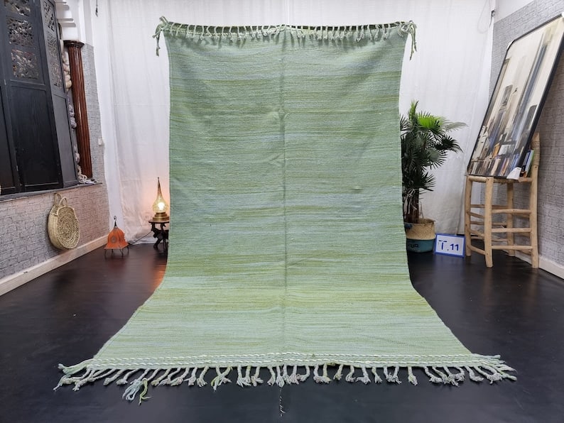Authentic Handwoven Green Rug 10 x 5 Feet from Morocco: Authentic Handwoven Green Rug 10 x 5 Feet from Morocco This authentic green rug is handwoven by local Berber women in the Atlas Mountains of Morocco, utilizing traditional tools and natural local wool