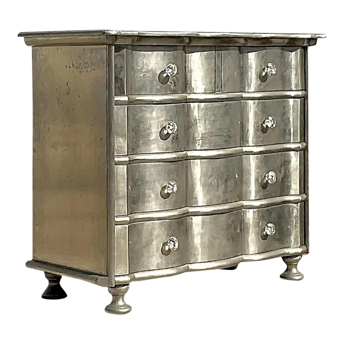 Vintage Boho Silver Leaf Wave Front Dresser from Palm Beach: Vintage Boho Silver Leaf Wave Front Dresser from Palm Beach Experience timeless elegance with this fabulous vintage Boho chest of drawers. This chic silver leaf cabinet features a striking wave front 