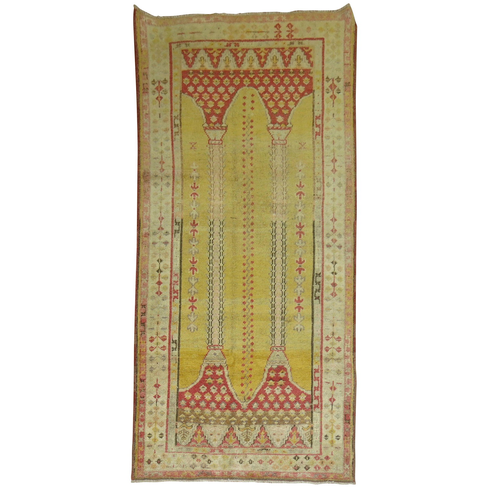 Circa 1920 Turkish Wool Islamic Prayer Niche Rug: Circa 1920 Turkish Wool Islamic Prayer Niche Rug This early 20th-century Turkish rug features a highly decorative double column prayer niche design set against a vibrant yellow background. Hand-woven 