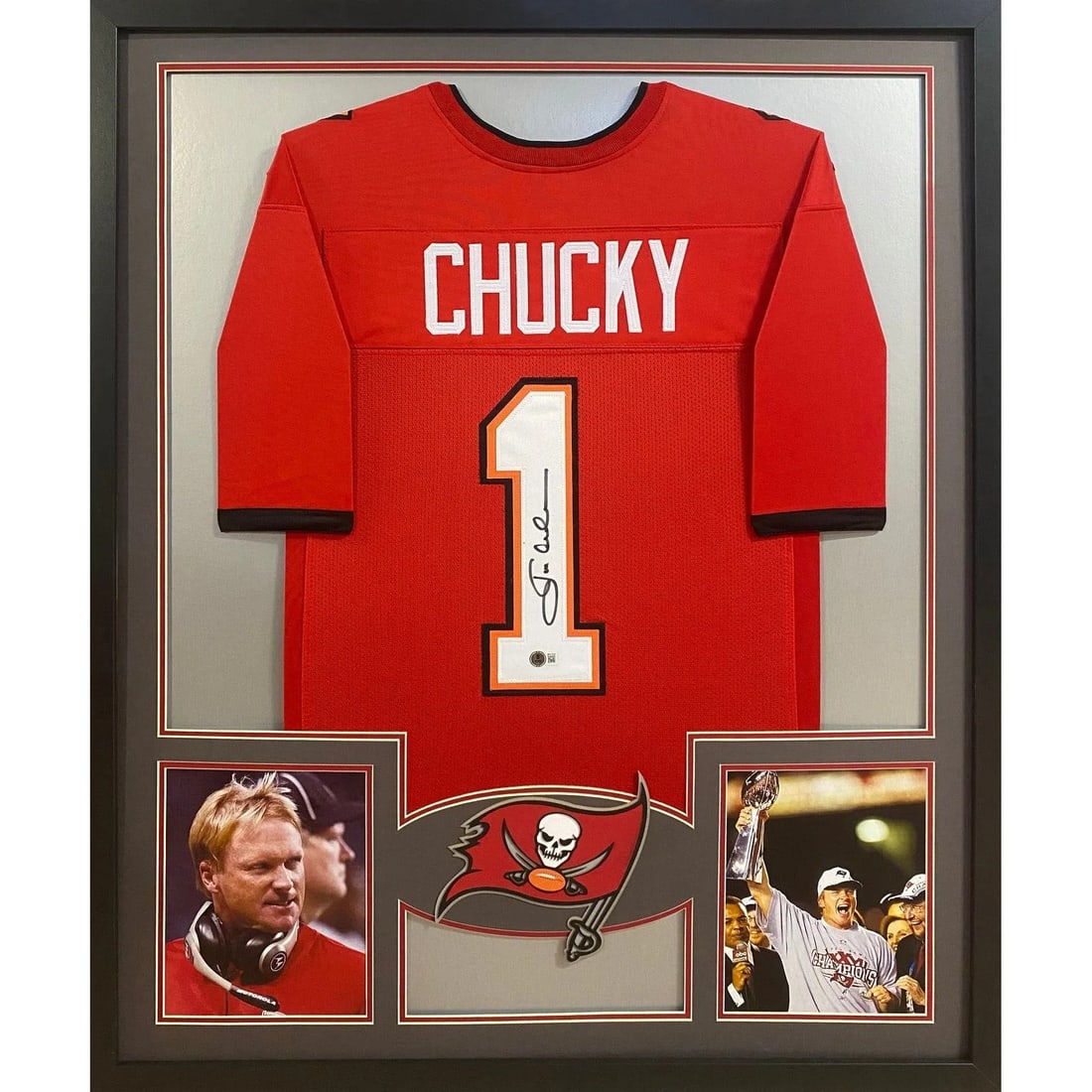 Framed Jon Gruden Autographed Tampa Bay Jersey Beckett Authenticated: Framed Jon Gruden Autographed Tampa Bay Jersey Beckett Authenticated This framed Tampa Bay Buccaneers jersey is autographed by Jon Gruden and authenticated by Beckett, featuring a tamper-proof sticker