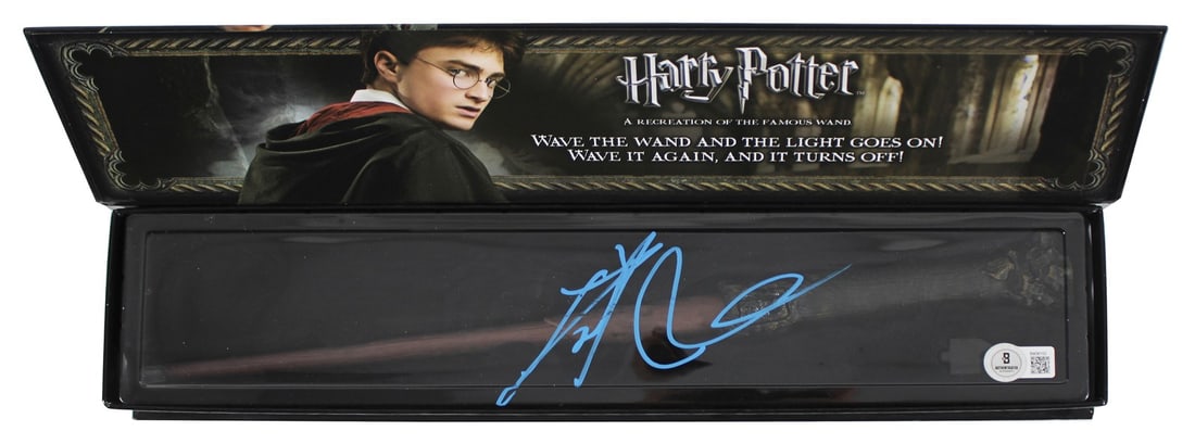 Beckett Authenticated Daniel Radcliffe Signed Harry Potter Wand BM36153: Beckett Authenticated Daniel Radcliffe Signed Harry Potter Wand BM36153 Autographed Harry Potter Illuminating Wand personally signed by Daniel Radcliffe. This original piece includes Beckett Authentic