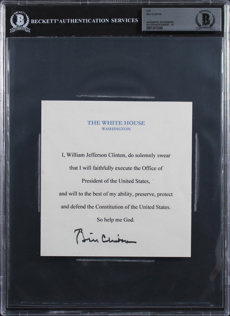 Bill Clinton Beckett Slabbed Oath Of Office Cut Signature 5.75x6: Bill Clinton Beckett Slabbed Oath Of Office Cut Signature 5.75x6 This is an original 5.75x6 inch cut signature featuring Bill Clinton's autograph from the Oath of Office. The autograph has received an