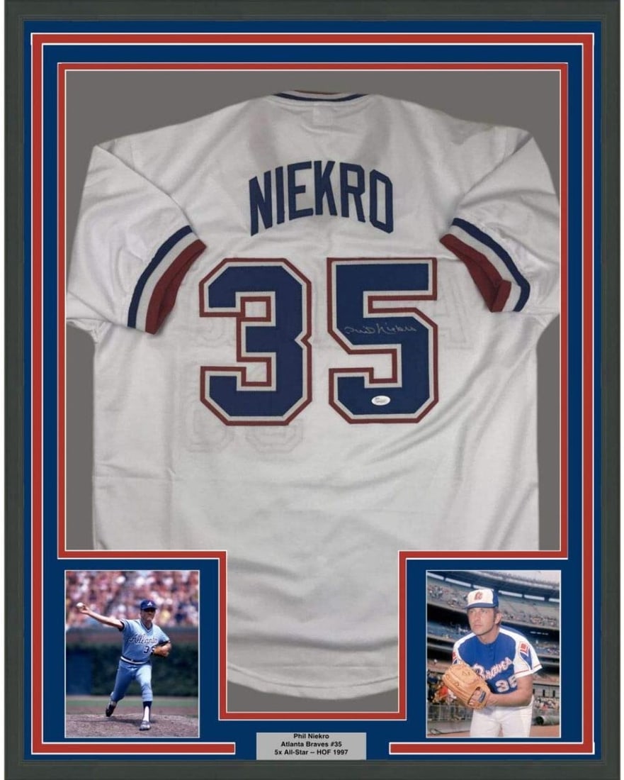 Framed Autographed Phil Niekro Atlanta Braves Jersey with JSA COA 33x42: Framed Autographed Phil Niekro Atlanta Braves Jersey with JSA COA 33x42 Celebrate the legacy of Phil Niekro with this stunning framed autographed jersey. This original Atlanta Braves white jersey is p