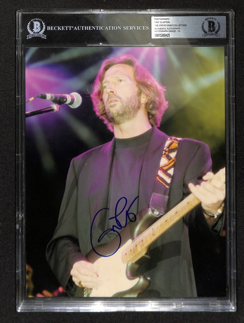 8x10 Eric Clapton Autographed Photo Beckett Graded 10 Slabbed: 8x10 Eric Clapton Autographed Photo Beckett Graded 10 Slabbed This 8x10 photograph features the authentic signature of Eric Clapton, signed in blue permanent marker. The autograph has been authenticat