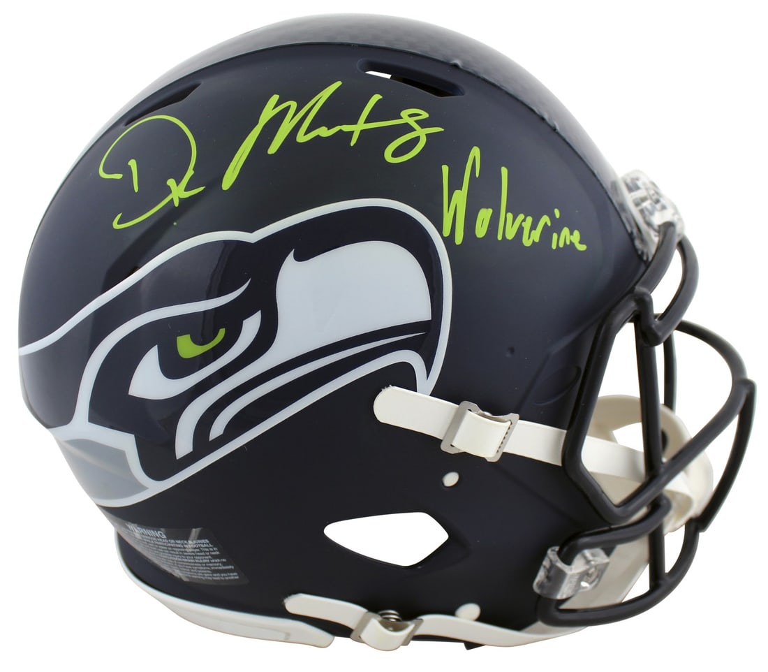 D.K. Metcalf Signed Seahawks Helmet with Wolverine Inscription BAS Authenticated: D.K. Metcalf Signed Seahawks Helmet with Wolverine Inscription BAS Authenticated This authentic full-size Speed Proline helmet is personally signed by D.K. Metcalf of the Seattle Seahawks, featuring t