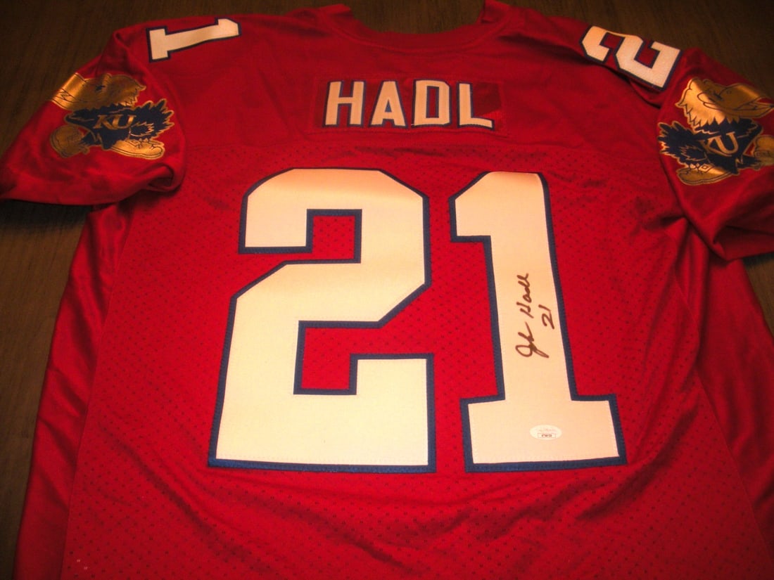 John Hadl Kansas Jayhawks Signed Adidas Jersey with JSA COA: John Hadl Kansas Jayhawks Signed Adidas Jersey with JSA COA This officially licensed Adidas jersey features the signature of John Hadl, a notable player for the Kansas Jayhawks. The jersey is a collec