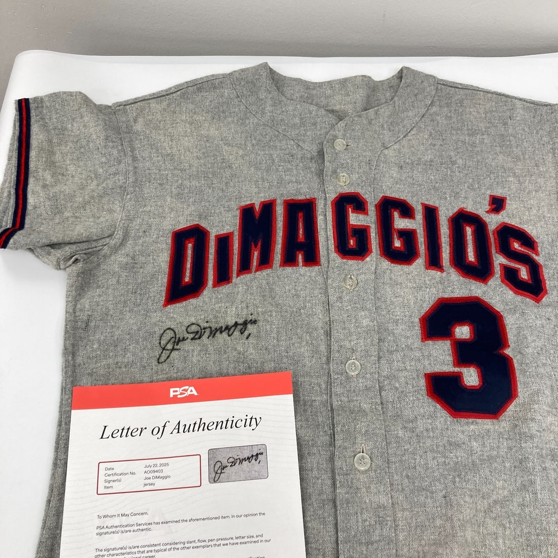 Joe DiMaggio Signed 1950s Jersey with PSA DNA COA: Joe DiMaggio Signed 1950s Jersey with PSA DNA COA Celebrate baseball history with this authentic Joe DiMaggio signed jersey from the 1950s. This gray flannel jersey, crafted by Strohl's of San Francis