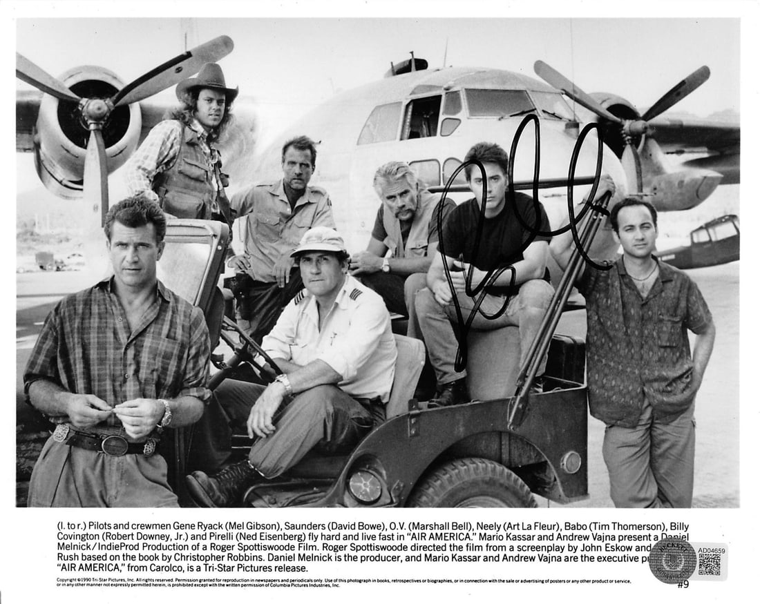 Robert Downey Jr. Signed Air America 8x10 BW Photo Beckett COA: Robert Downey Jr. Signed Air America 8x10 BW Photo Beckett COA This authentic black and white 8x10 photograph features the signature of Robert Downey Jr., known for his role in 'Air America.' The phot