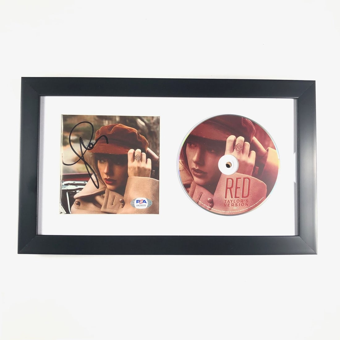 Taylor Swift RED Signed Framed CD Cover PSA/DNA Authentic: Taylor Swift RED Signed Framed CD Cover PSA/DNA Authentic This framed CD album cover features the autograph of Taylor Swift on her RED album. The signature has been authenticated by PSA/DNA, ensuring 
