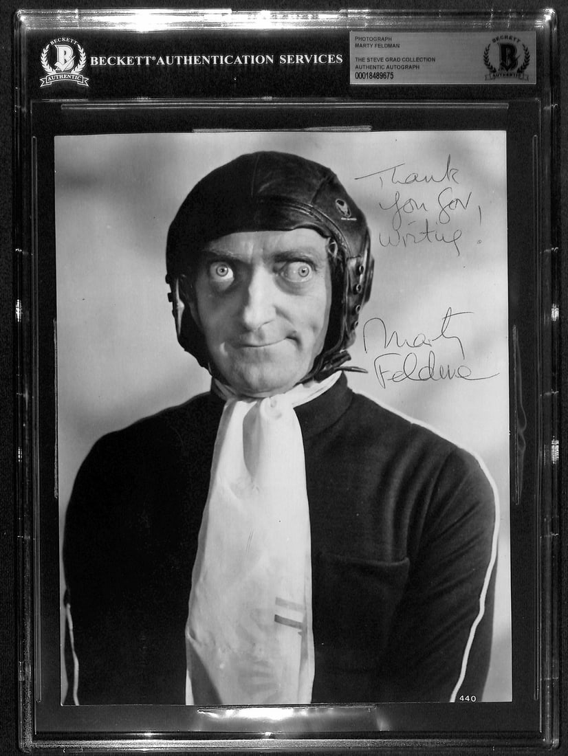 Marty Feldman Signed 8x10 Photo Last Remake of Beau Geste Beckett Authenticated: Marty Feldman Signed 8x10 Photo Last Remake of Beau Geste Beckett Authenticated This rare 8x10 black-and-white photograph is signed and inscribed by the legendary British comedian Marty Feldman. The a