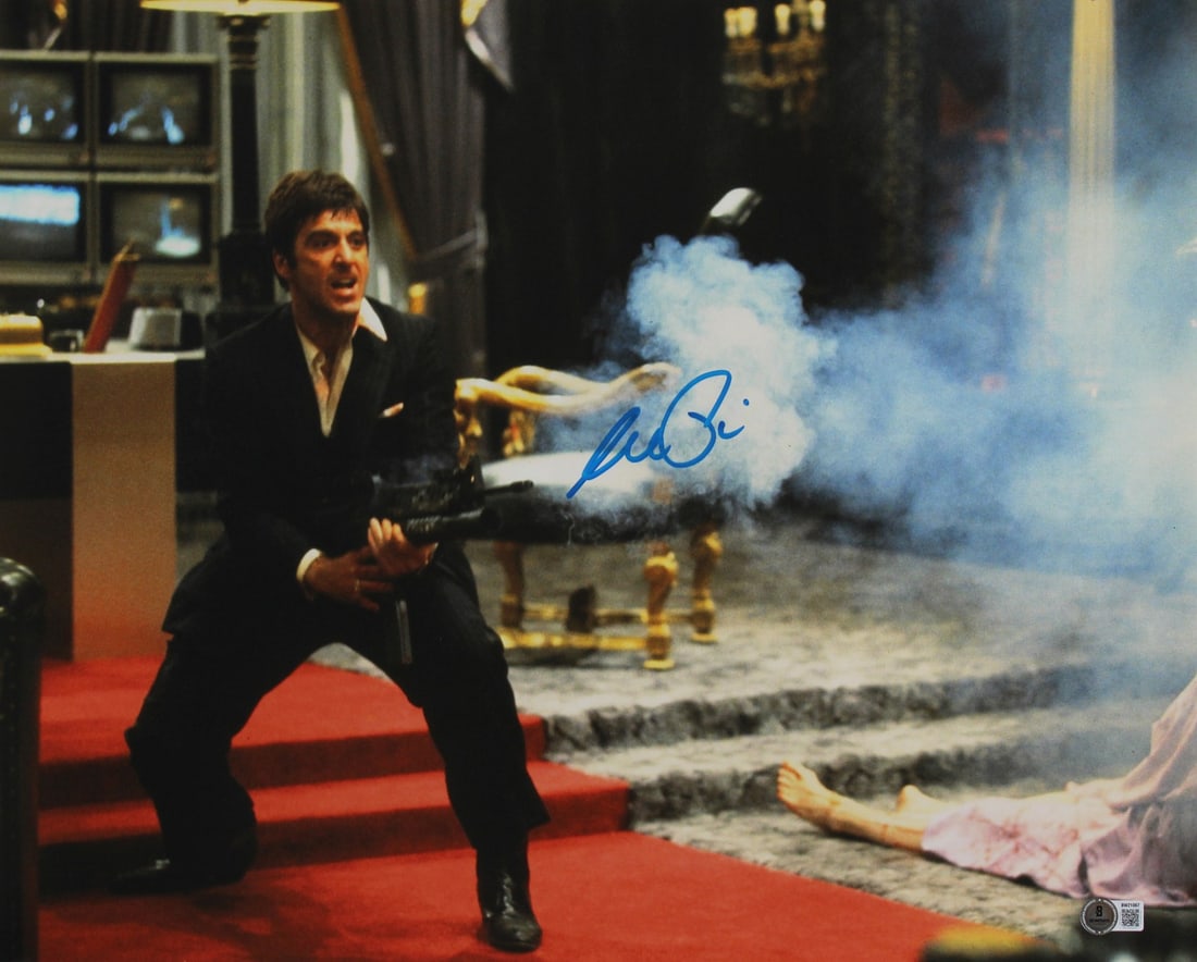 Al Pacino Signed Scarface 16x20 Photo Beckett Authenticated Horizontal Shooting Scene: Al Pacino Signed Scarface 16x20 Photo Beckett Authenticated Horizontal Shooting Scene This is an original 16x20 horizontal photograph featuring Al Pacino in his iconic role from Scarface. The photo ha