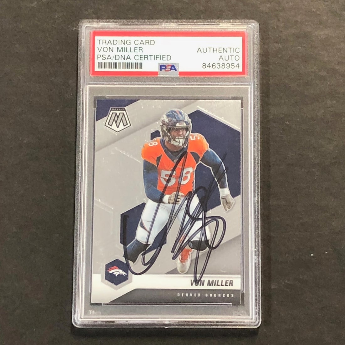 Von Miller PSA Authenticated Signed 2021 Mosaic Football Card Broncos: Von Miller PSA Authenticated Signed 2021 Mosaic Football Card Broncos This is a 2021 Panini Mosaic #71 sports trading card featuring Von Miller of the Denver Broncos. The card has been personally sign