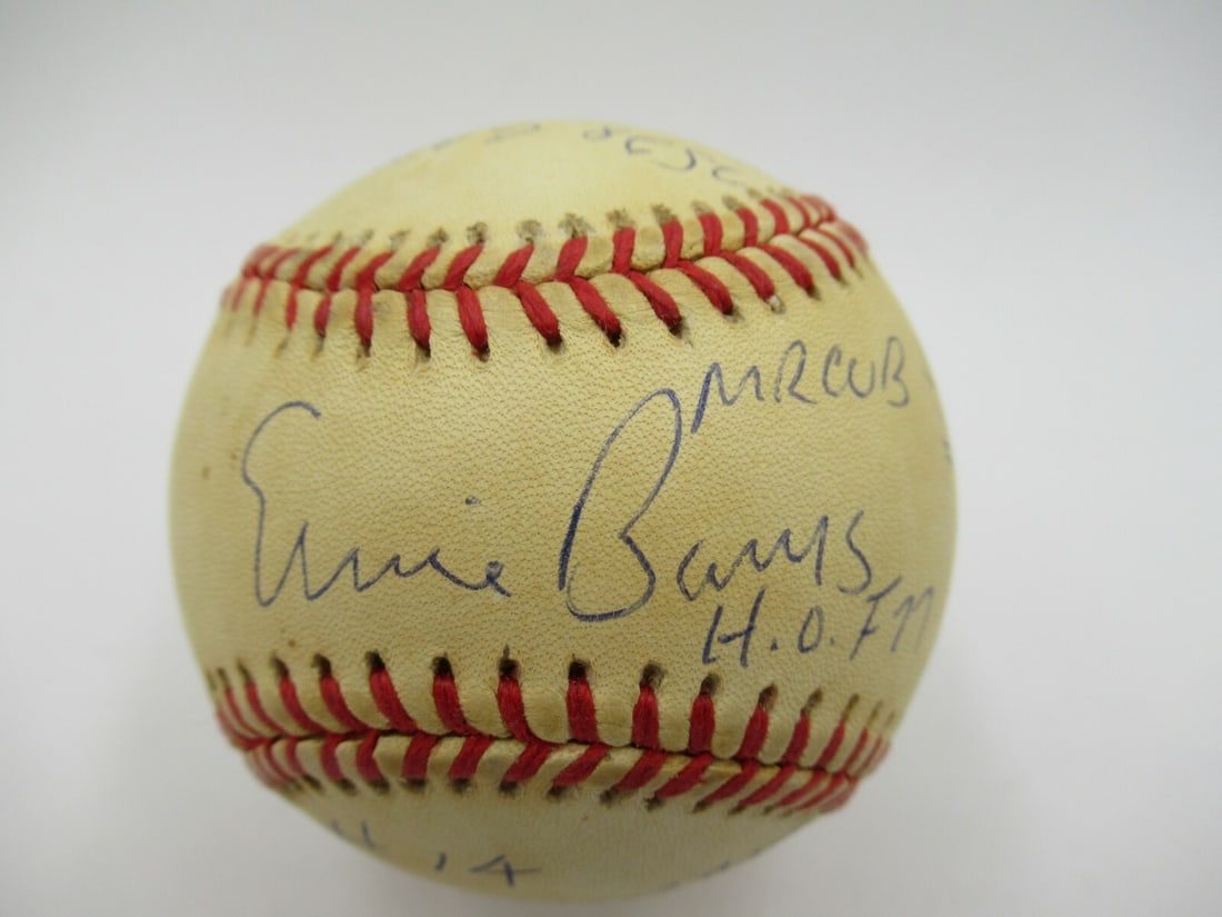 Ernie Banks Signed Baseball with Career Stats Inscription COA from Reggie Jackson: Ernie Banks Signed Baseball with Career Stats Inscription COA from Reggie Jackson This original baseball is signed by Ernie Banks and features heavy inscriptions detailing his career statistics. It co