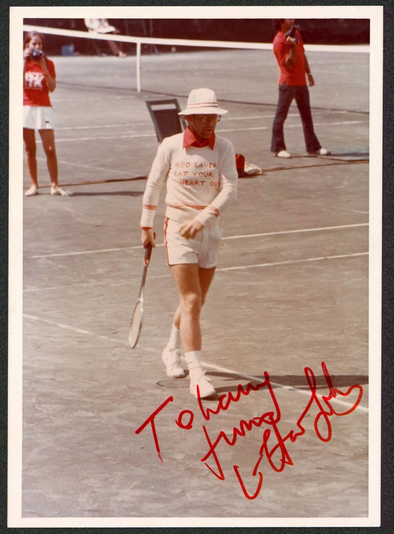 5x7 Photo Inscribed To Larry Signed by Elton John JSA Authenticated: 5x7 Photo Inscribed To Larry Signed by Elton John JSA Authenticated This is a 5x7 Type 1 photograph signed by Elton John, featuring the inscription "To Larry." The autograph has been authenticated by 
