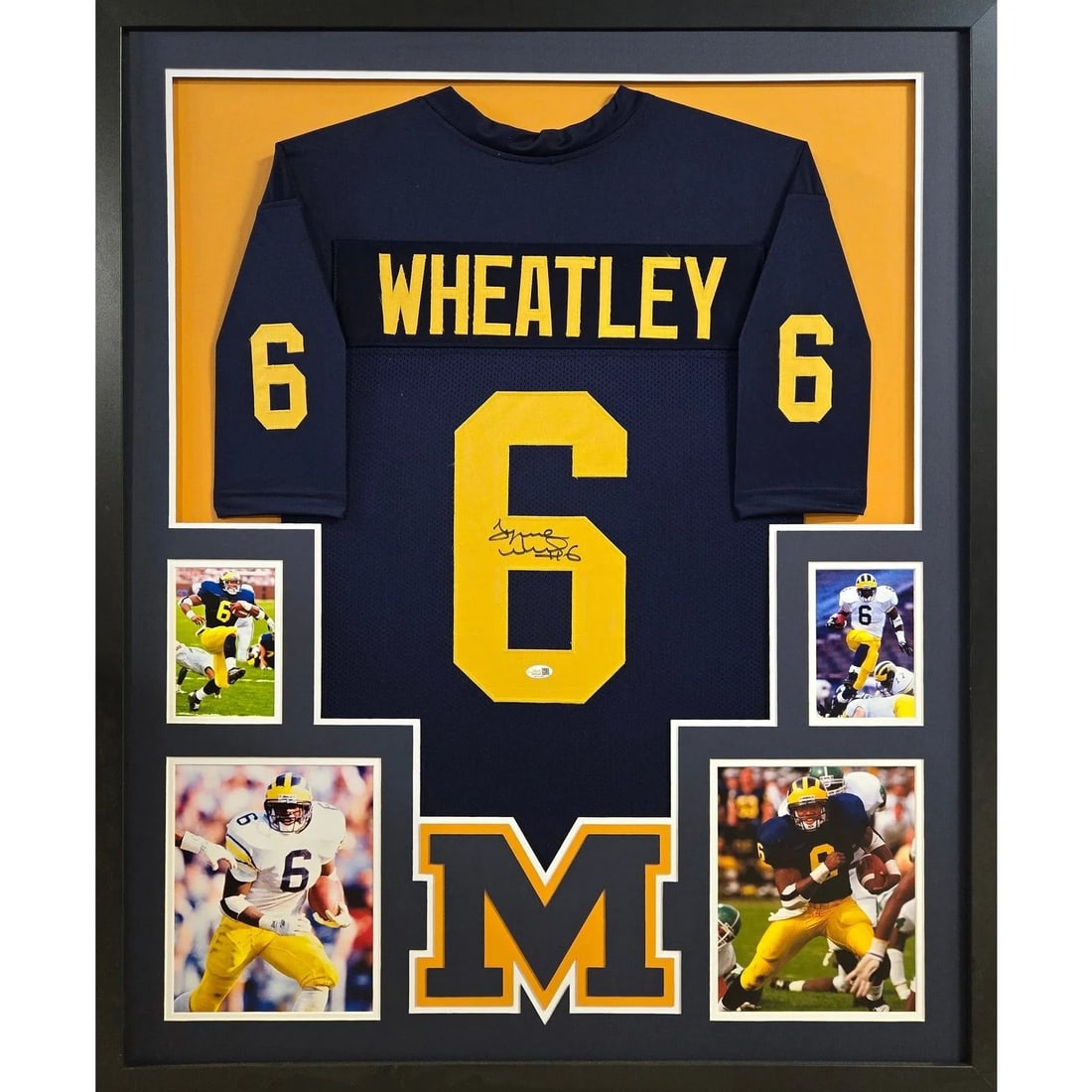 Framed Tyrone Wheatley autographed Michigan jersey JSA authenticated: Framed Tyrone Wheatley autographed Michigan jersey JSA authenticated This framed jersey features the autograph of Tyrone Wheatley and is presented with attention to detail, including the Michigan logo