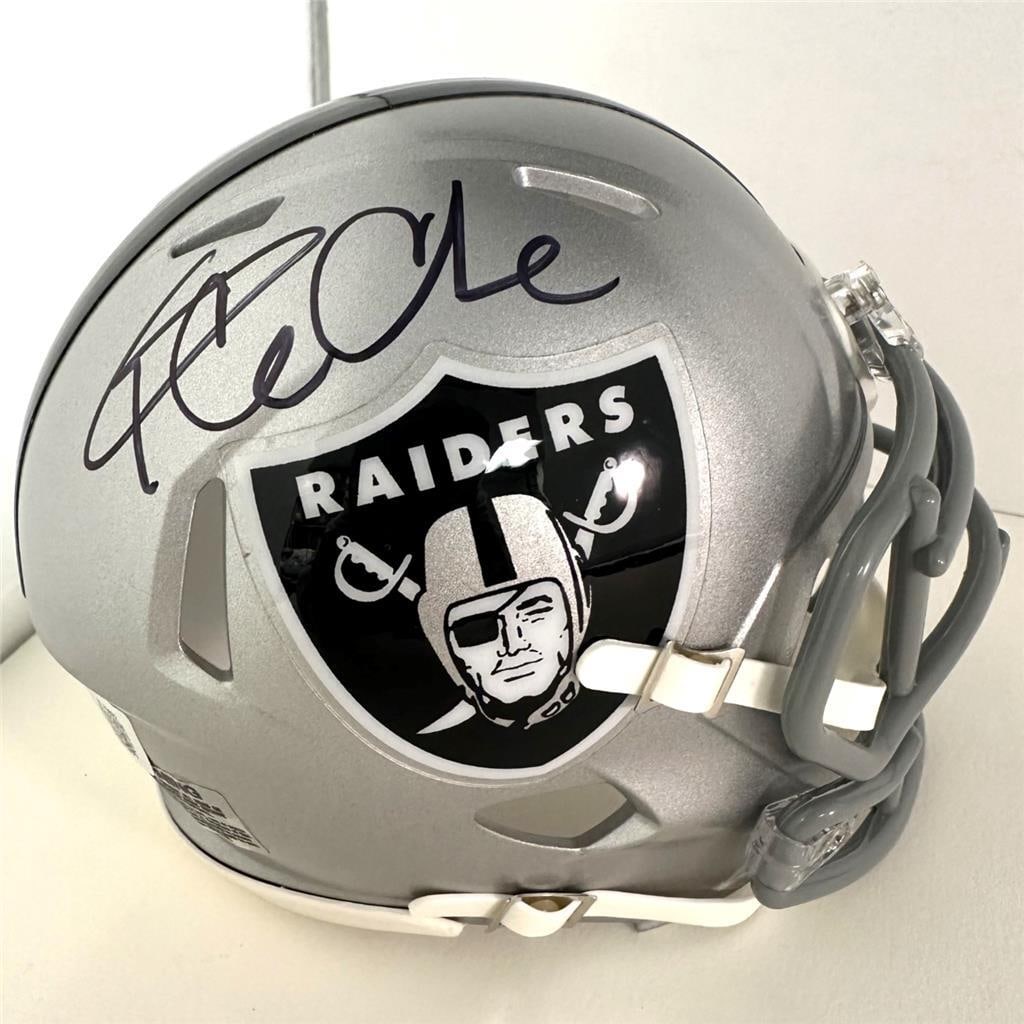 Ice Cube Autographed Raiders Mini Helmet Beckett Authenticated: Ice Cube Autographed Raiders Mini Helmet Beckett Authenticated This is an original signed mini helmet featuring the autograph of Ice Cube, the iconic rapper from N.W.A. The helmet is a collectible ite