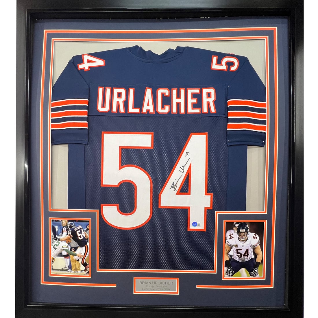 Brian Urlacher Signed Chicago Bears Jersey Framed 33x42 Beckett Authenticated: Brian Urlacher Signed Chicago Bears Jersey Framed 33x42 Beckett Authenticated This framed Chicago Bears blue jersey is autographed by Brian Urlacher and comes with a Beckett Certificate of Authenticit