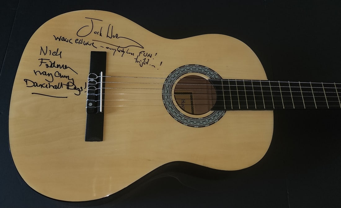 Wang Chung autographed guitar Beckett Authentication: Wang Chung autographed guitar Beckett Authentication This guitar and guitar pick set is autographed by Wang Chung members Nick Feldman and Jack Hues. The signatures are authenticated by Beckett Authen