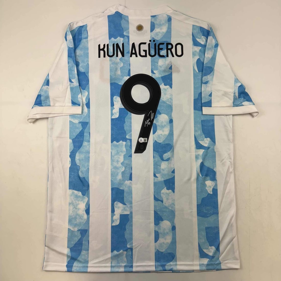 Autographed Sergio Aguero 2021 Argentina Soccer Jersey Beckett COA: Autographed Sergio Aguero 2021 Argentina Soccer Jersey Beckett COA This is an authentic autographed blue soccer jersey of Sergio Kun Aguero, representing Argentina during the 2021 World Cup. The jerse