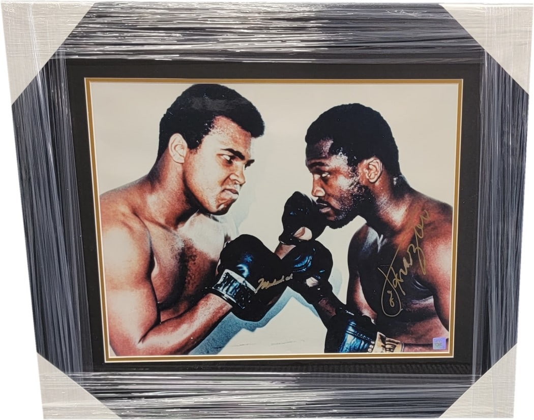 Muhammad Ali Joe Frazier Dual Signed 16x20 Photo Authenticated: Muhammad Ali Joe Frazier Dual Signed 16x20 Photo Authenticated This striking 16x20 photo captures the legendary boxing match between Muhammad Ali and Joe Frazier, featuring dual hand signatures from