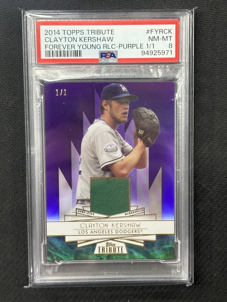 Clayton Kershaw 2014 Topps Tribute PSA 8 Forever Young Relic Card #FYRCK: Clayton Kershaw 2014 Topps Tribute PSA 8 Forever Young Relic Card #FYRCK This is a 2014 Topps Tribute Forever Young Relic baseball card featuring Clayton Kershaw, a star player for the Los Angeles