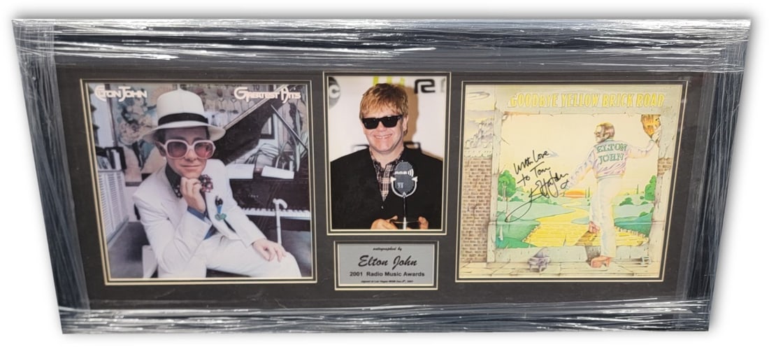 Elton John Signed Yellow Brick Road Album Framed JSA Authenticated: Elton John Signed Yellow Brick Road Album Framed JSA Authenticated This exceptional item features a hand-signed album by the legendary Elton John, showcasing the iconic 'Yellow Brick Road' record. The