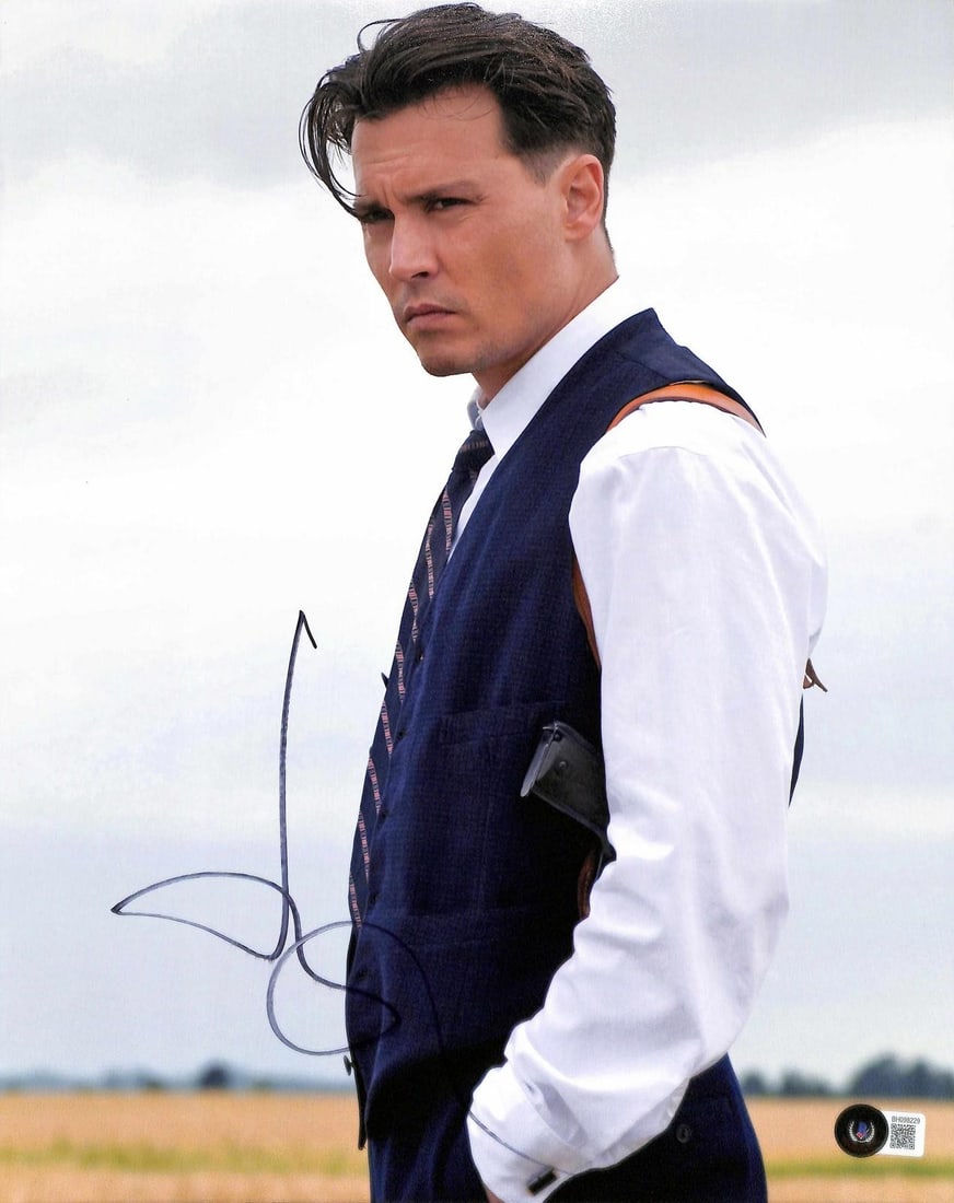 Johnny Depp Public Enemies 8x10 Beckett signed photo: Johnny Depp Public Enemies 8x10 Beckett signed photo This 8x10 photograph features acclaimed actor Johnny Depp in a vintage-style look from the movie Public Enemies. The photo is hand-signed by Johnny