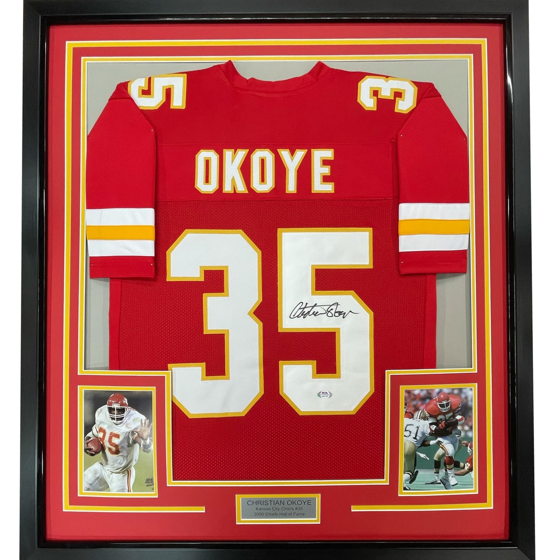 Christian Okoye signed Kansas City Chiefs framed jersey JSA COA 33x42: Christian Okoye signed Kansas City Chiefs framed jersey JSA COA 33x42 This framed Kansas City Chiefs jersey features an authentic signature from Christian Okoye. The jersey is professionally framed an