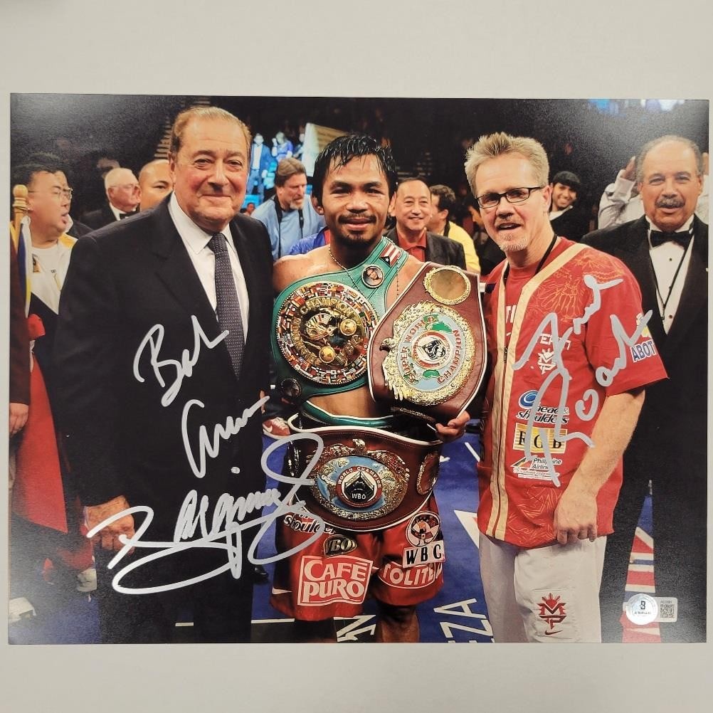 11x14 Photograph Signed by Pacquiao Roach Arum Beckett Authenticated: 11x14 Photograph Signed by Pacquiao Roach Arum Beckett Authenticated This is an original 11x14 inch photograph signed by Manny Pacquiao, Freddie Roach, and Bob Arum. The autographs are authenticated b