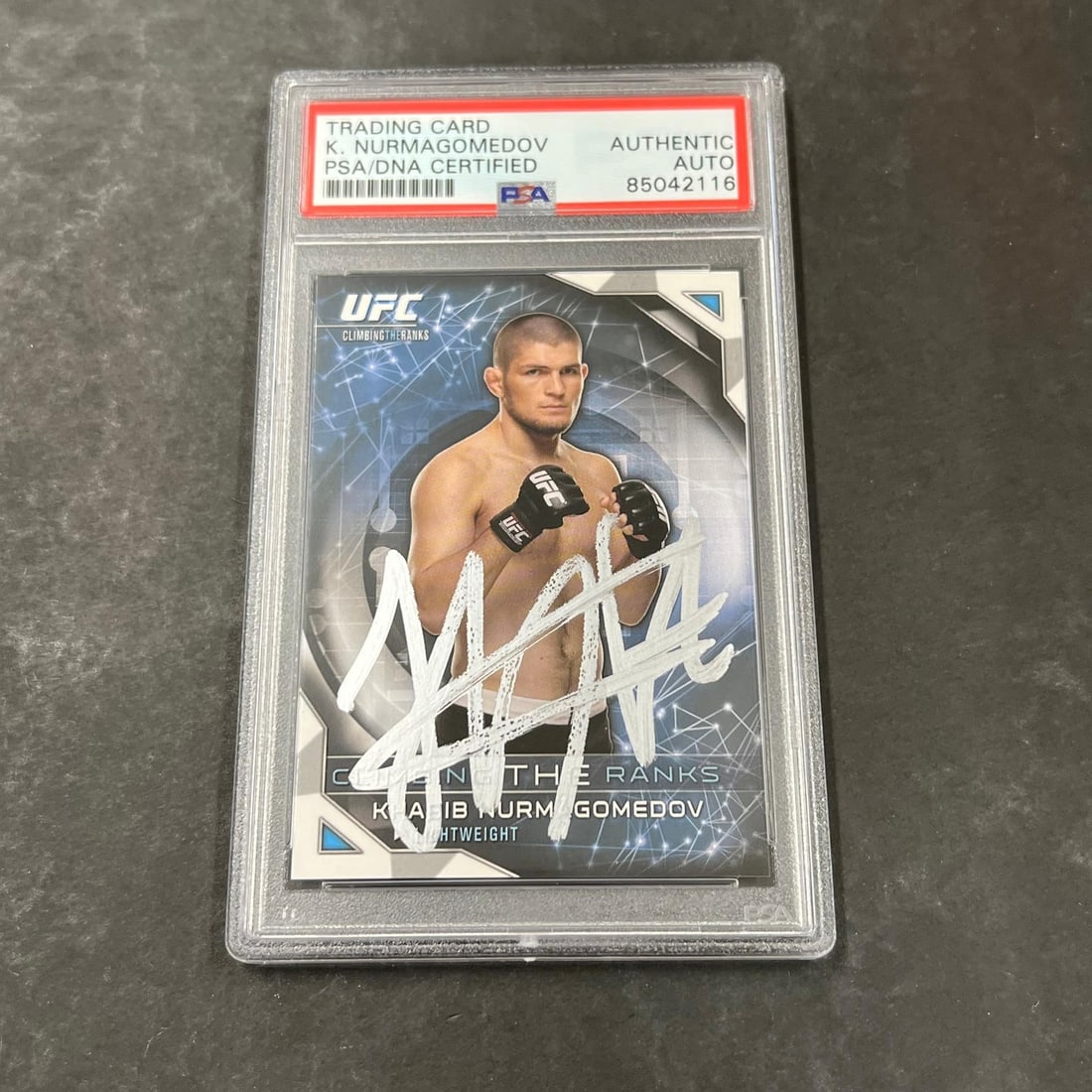 2015 Topps Khabib Nurmagomedov Autographed Card PSA Authentication #Climb-5: 2015 Topps Khabib Nurmagomedov Autographed Card PSA Authentication #Climb-5 Presenting the 2015 Topps #Climb-5 card featuring the signature of MMA champion Khabib Nurmagomedov. This sports trading car