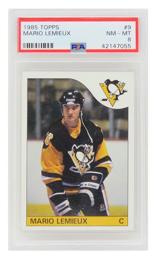 Mario Lemieux 1985 Topps RC Rookie Card #9 PSA 8 Pittsburgh Penguins: Mario Lemieux 1985 Topps RC Rookie Card #9 PSA 8 Pittsburgh Penguins This is a Mario Lemieux rookie trading card from the 1985 Topps Hockey set, showcasing the legendary player of the Pittsburgh Pengu