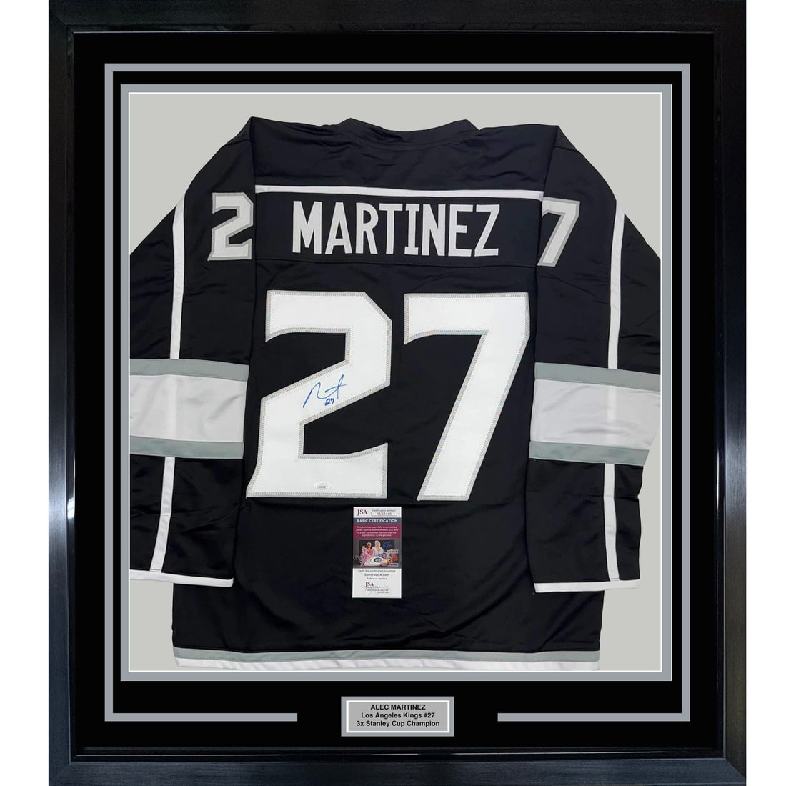 Framed Signed Alec Martinez Los Angeles Kings Jersey with JSA COA: Framed Signed Alec Martinez Los Angeles Kings Jersey with JSA COA Celebrate your fandom with this professionally framed and matted autographed Alec Martinez Los Angeles Kings jersey. Measuring an impr